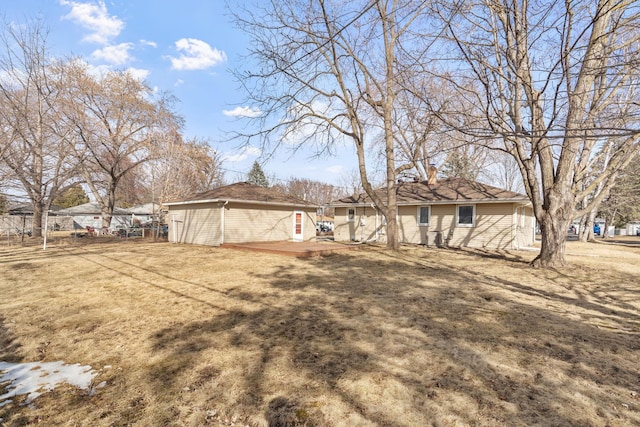 view of yard with a deck and fence