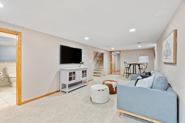 living area with stairway, recessed lighting, and carpet