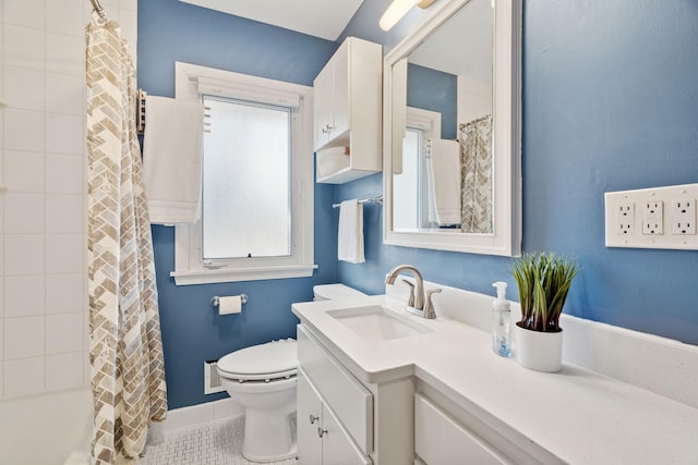 bathroom featuring tile patterned flooring, curtained shower, toilet, and vanity