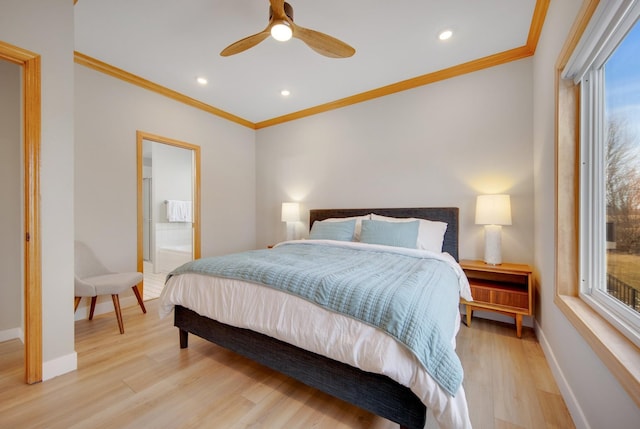 bedroom with baseboards, crown molding, and light wood finished floors