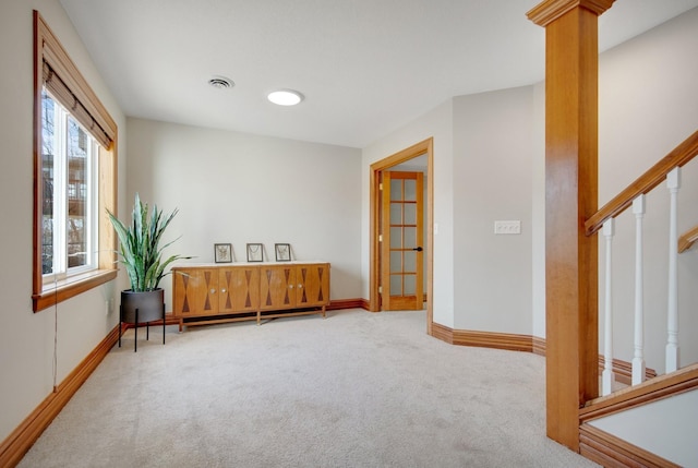 sitting room featuring stairway, visible vents, baseboards, and carpet floors