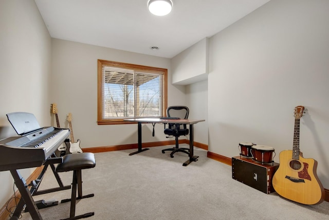 carpeted home office with baseboards