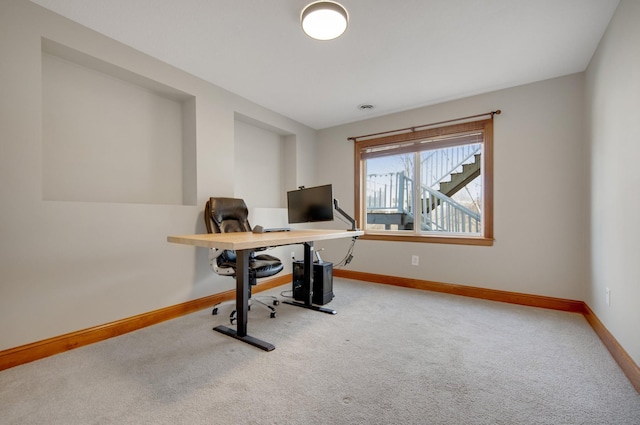 home office featuring baseboards and carpet flooring