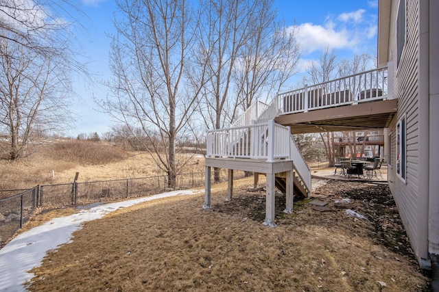 view of yard featuring stairway, a wooden deck, and fence