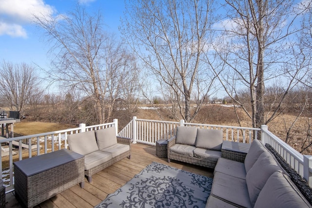 wooden terrace featuring an outdoor living space