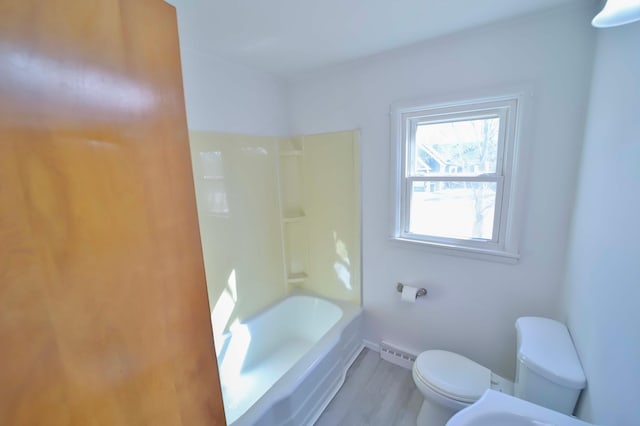 full bathroom with toilet, baseboards, and wood finished floors