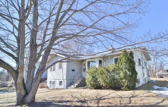 view of front of home with a chimney