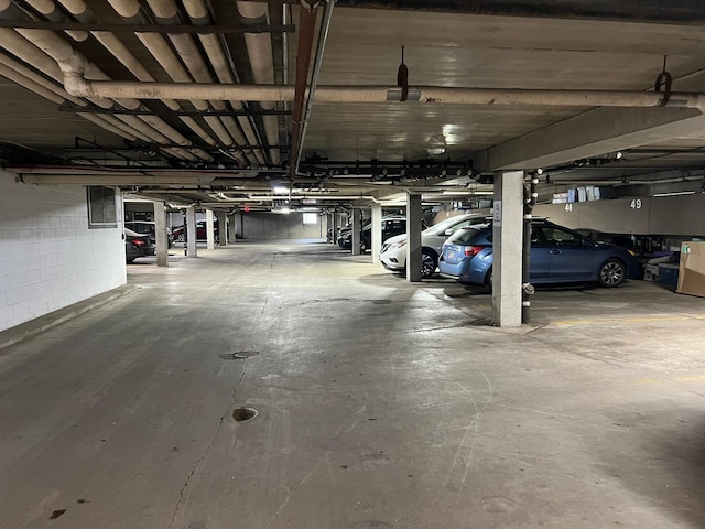 parking deck featuring concrete block wall