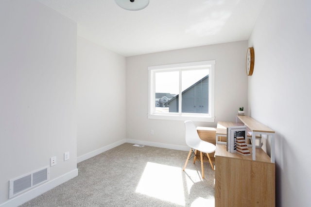 home office with visible vents, baseboards, and carpet floors