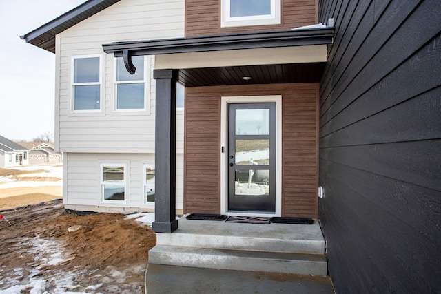 entrance to property featuring covered porch