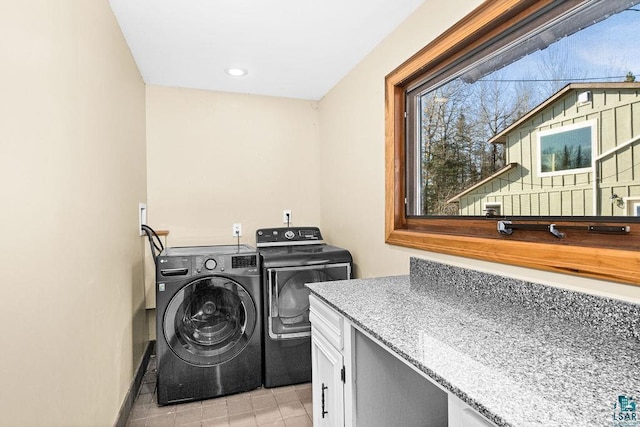 clothes washing area featuring washing machine and clothes dryer, laundry area, recessed lighting, and light tile patterned flooring