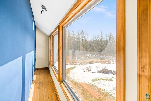 unfurnished sunroom featuring lofted ceiling