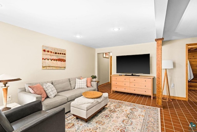 living room featuring recessed lighting, baseboards, stairs, and tile patterned floors