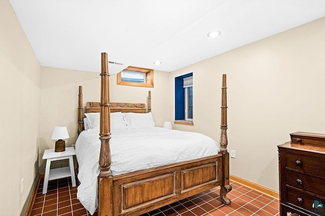 bedroom featuring dark tile patterned floors, recessed lighting, and baseboards