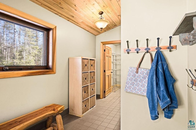 mudroom featuring tile patterned floors, vaulted ceiling, wooden ceiling, and baseboards