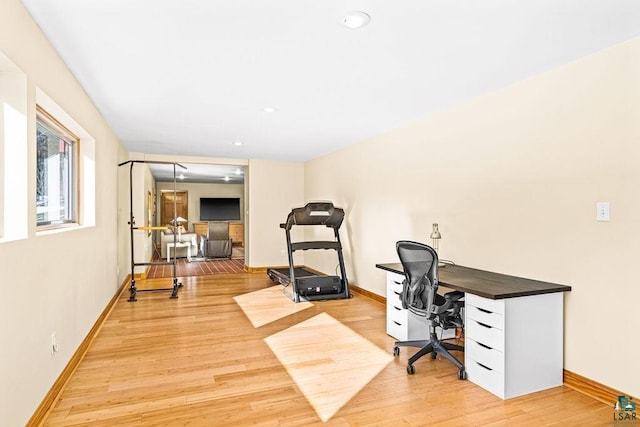 office featuring baseboards, light wood-type flooring, and recessed lighting
