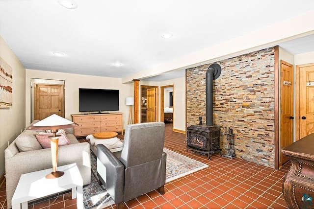 living room with a wood stove, tile patterned floors, and recessed lighting