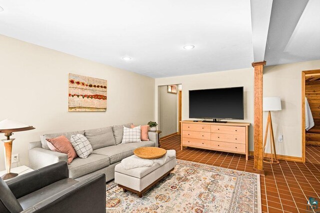 tiled living room featuring recessed lighting and baseboards