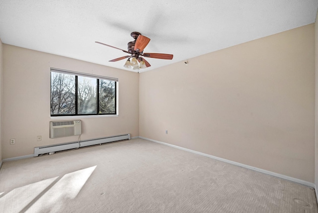 spare room featuring a wall unit AC, a ceiling fan, baseboards, light colored carpet, and baseboard heating