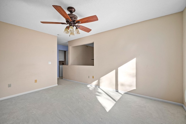 unfurnished room featuring ceiling fan, baseboards, and carpet floors