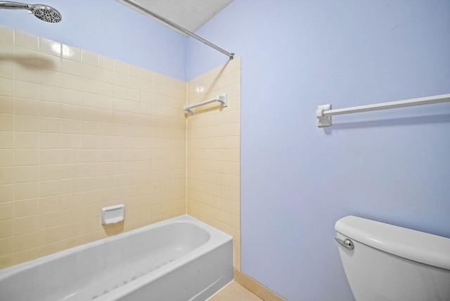 full bath with baseboards, toilet, shower / washtub combination, and tile patterned flooring