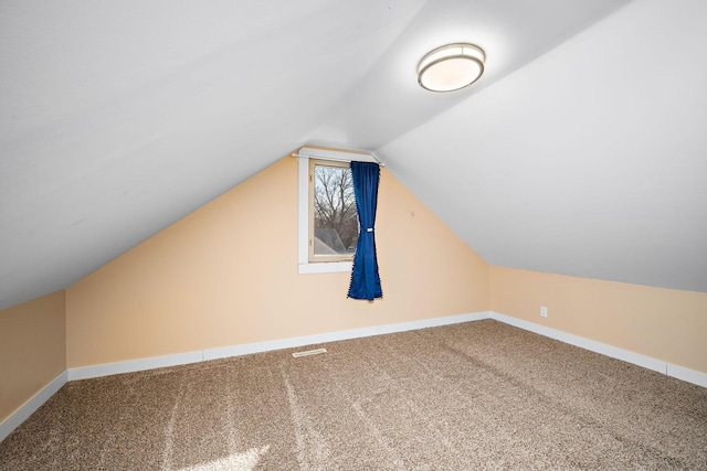 bonus room featuring visible vents, baseboards, lofted ceiling, and carpet floors