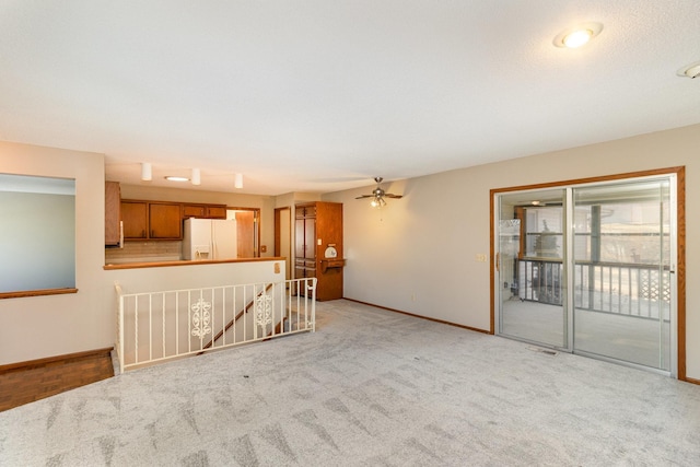 unfurnished living room with visible vents and baseboards