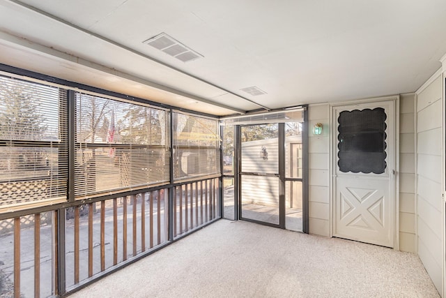 unfurnished sunroom with visible vents