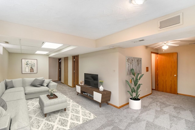 carpeted living room with baseboards and visible vents