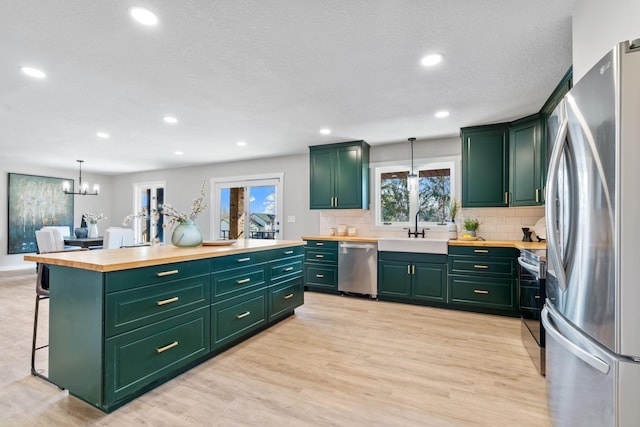 kitchen featuring green cabinetry and stainless steel appliances