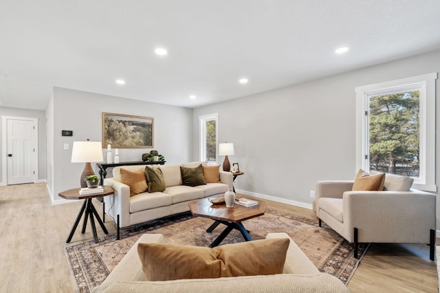 living room featuring recessed lighting and light wood-style floors