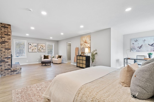 bedroom with recessed lighting, baseboards, and wood finished floors