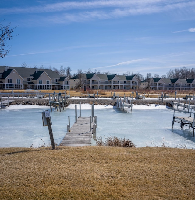 dock area with a yard and a residential view