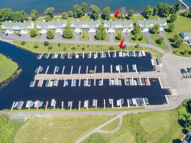 birds eye view of property with a water view