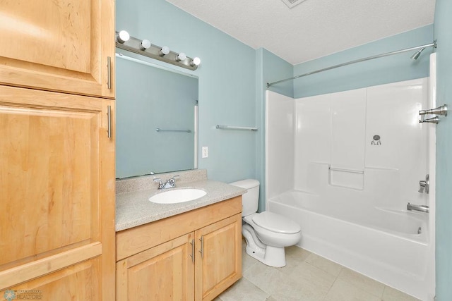 full bathroom with vanity, tile patterned flooring, a textured ceiling, shower / bathing tub combination, and toilet