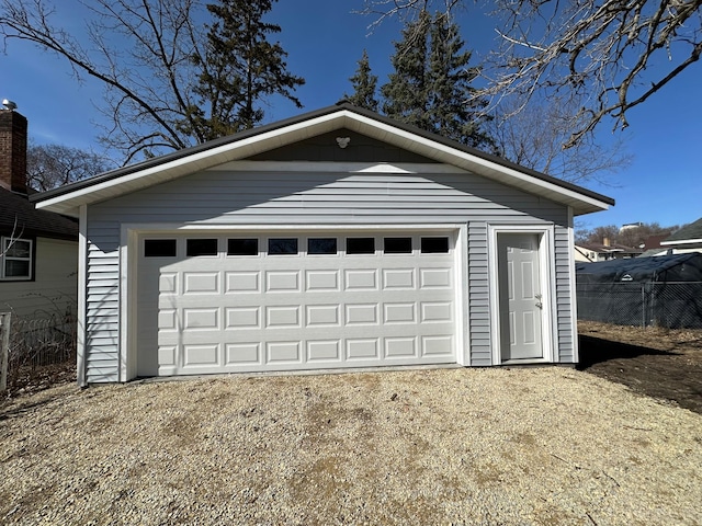 detached garage with fence