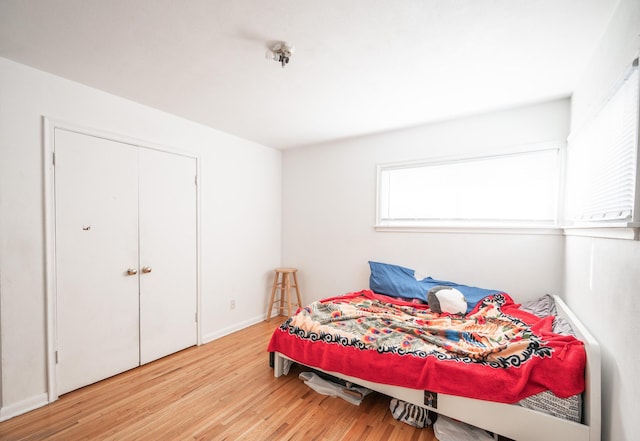 bedroom with wood finished floors