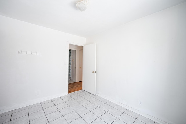 empty room with light tile patterned floors