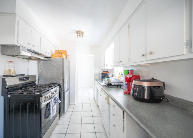 kitchen with under cabinet range hood, light tile patterned floors, appliances with stainless steel finishes, and white cabinetry