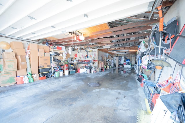 garage featuring a workshop area and a garage door opener