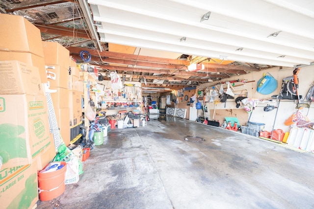 garage with a workshop area and a garage door opener