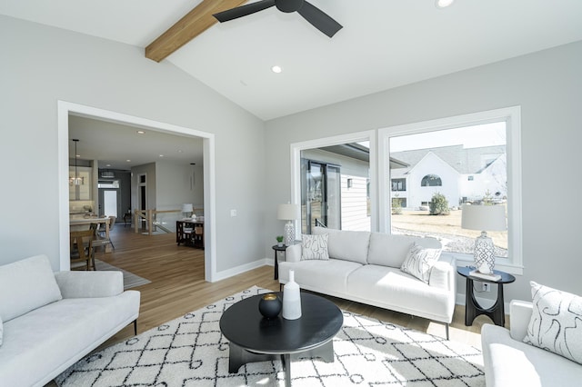 living area with vaulted ceiling with beams, baseboards, recessed lighting, wood finished floors, and a ceiling fan