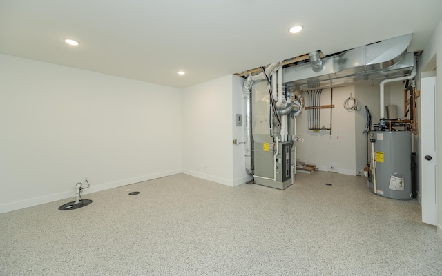 unfinished below grade area with heating unit, recessed lighting, gas water heater, and baseboards