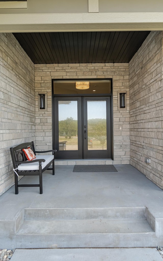 view of exterior entry with a porch