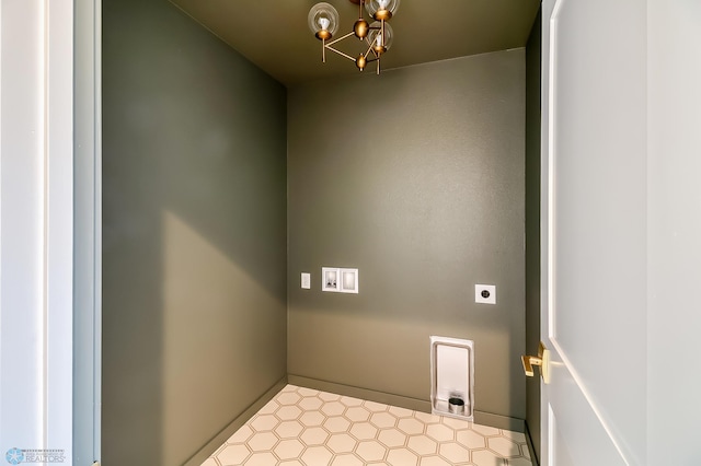 laundry room featuring laundry area, a notable chandelier, and electric dryer hookup