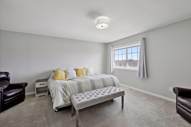 bedroom with carpet flooring, visible vents, and baseboards