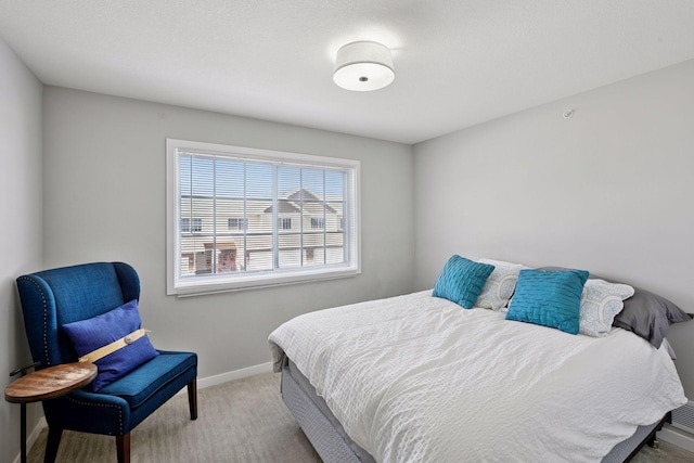 bedroom with carpet and baseboards