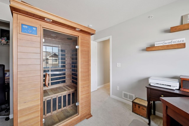 view of sauna / steam room with baseboards and carpet floors