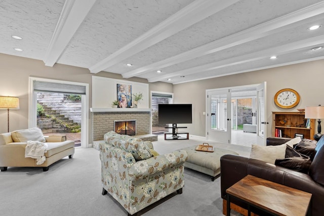 carpeted living room with recessed lighting, beamed ceiling, a healthy amount of sunlight, and a brick fireplace