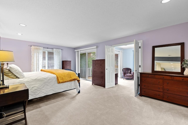 carpeted bedroom featuring recessed lighting and access to outside